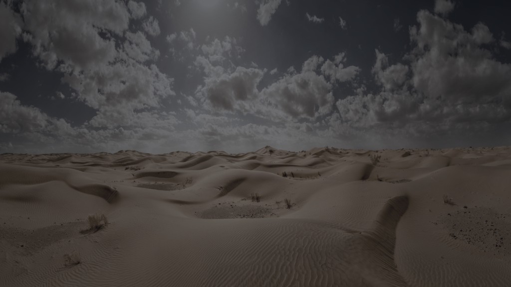 Desert dunes under a dark sky.