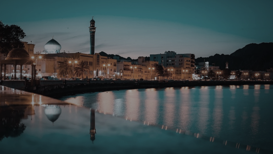 Muscat waterfront at night.